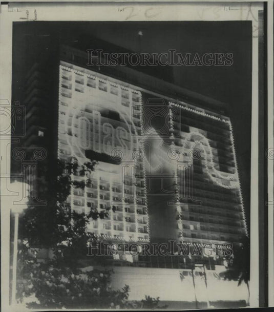 1967 Havana's Habana Libre's neon sign flashes meeting of OLAS - Historic Images