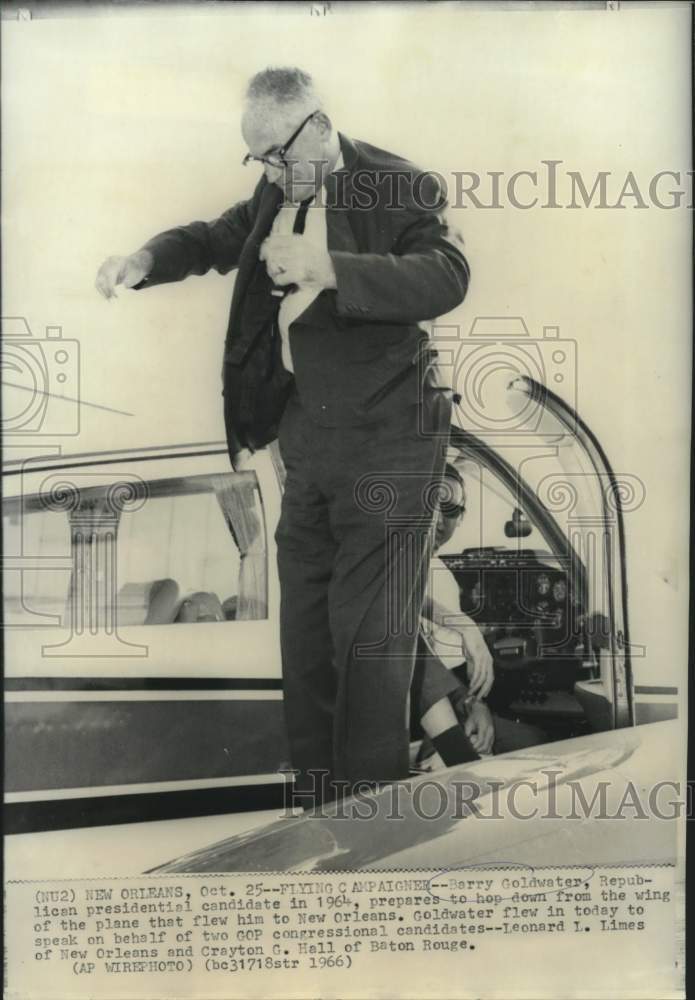 1966 Barry Goldwater stands on wing of plane in New Orleans - Historic Images