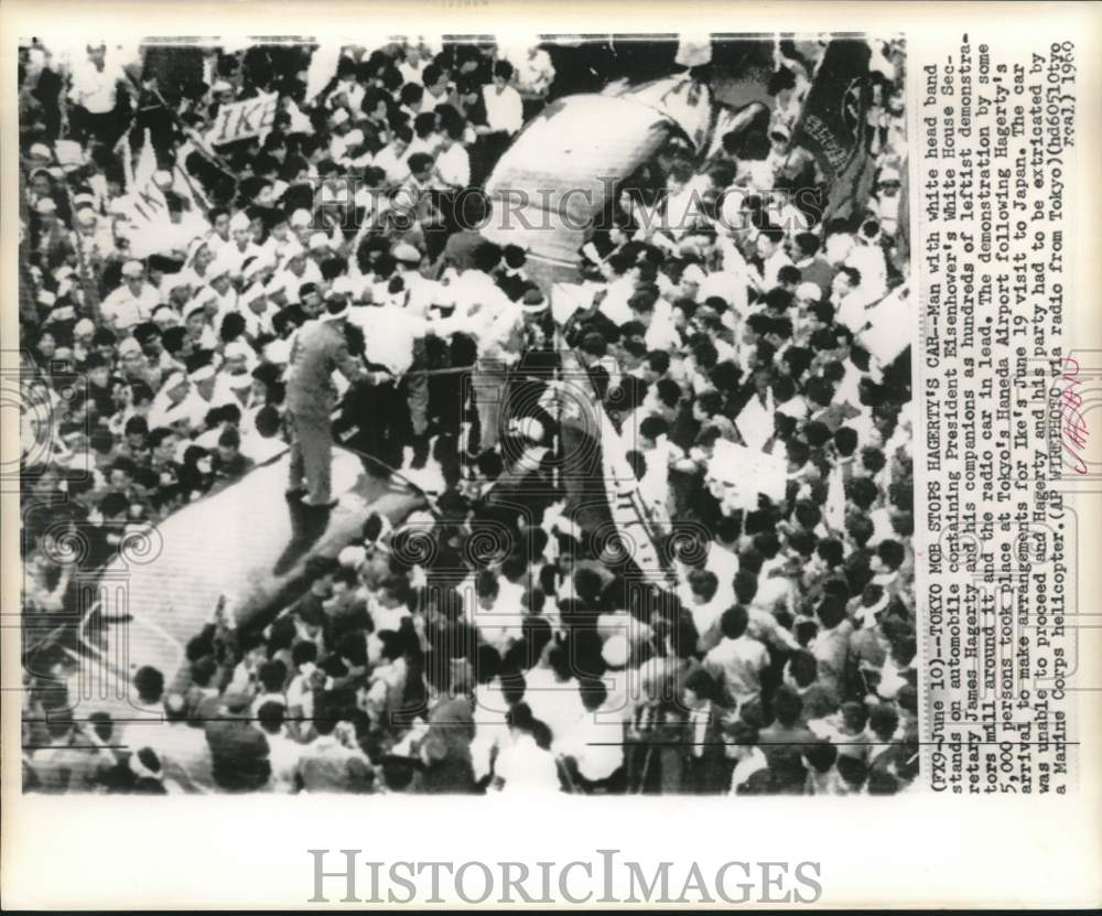 1960 Demonstrators surround James Hagerty&#39;s car at Tokyo&#39;s airport - Historic Images