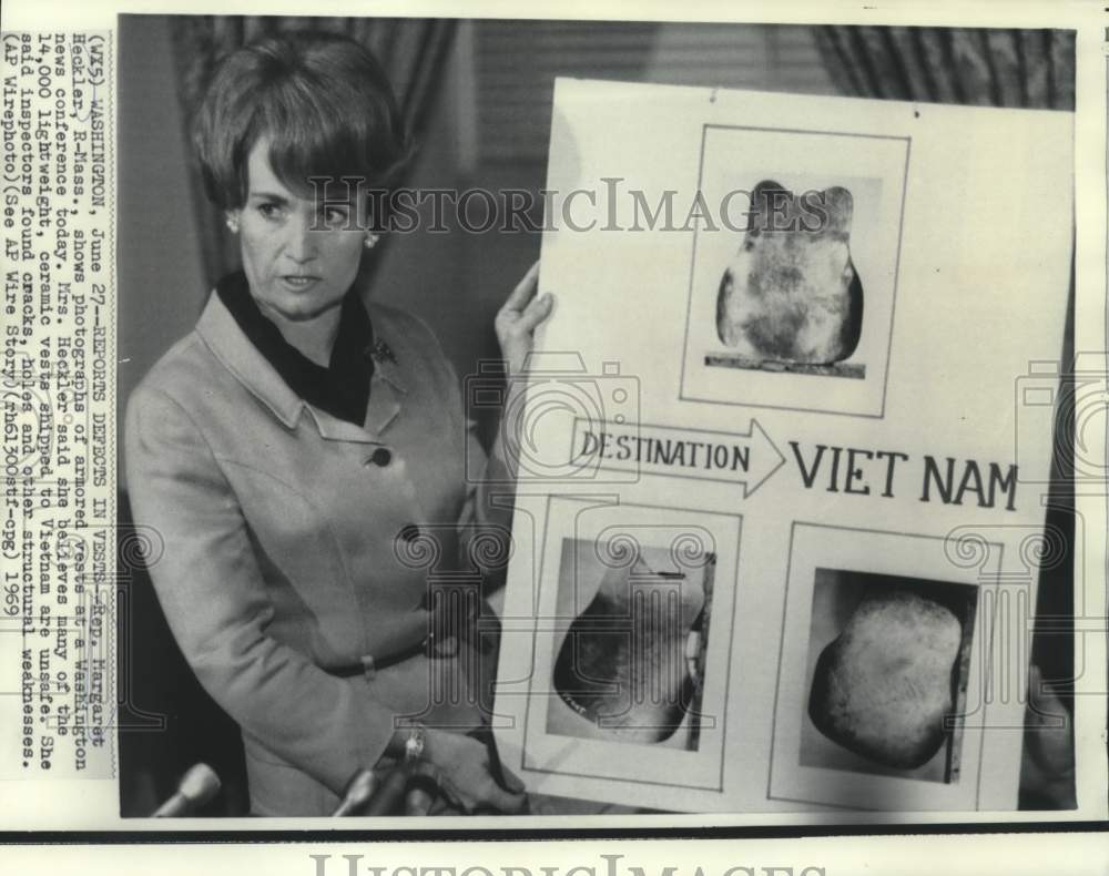 1969 Representative Margaret Heckler shows defects in military vests - Historic Images