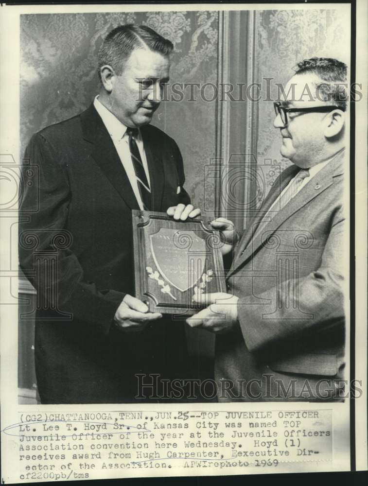 1969 Hugh Carpenter presents Juvenile Officer Award to Lee T. Hoyd - Historic Images