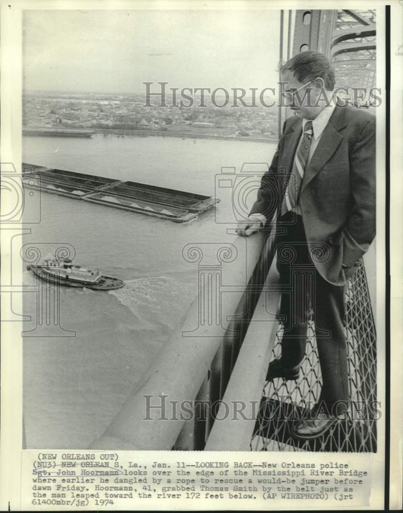 1974 New Orleans police Sgt. Hoormann looks over MS River Bridge - Historic Images