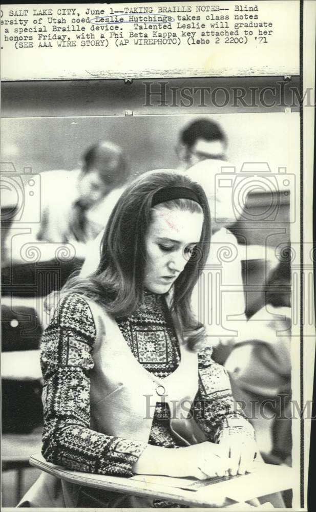 1971 Leslie Hutchings takes class notes on Braille device. - Historic Images