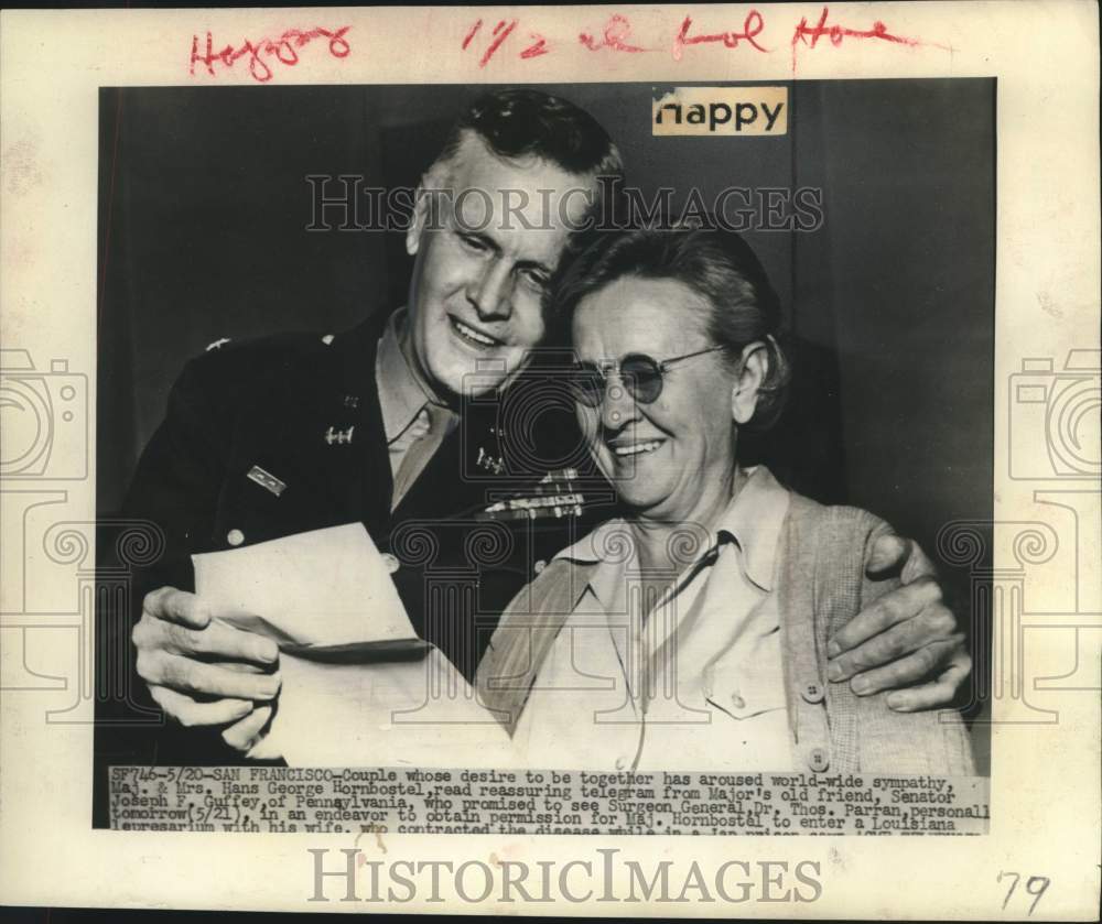 1946 Press Photo Major and Mrs. George Hornbostel read telegram in San Francisco-Historic Images
