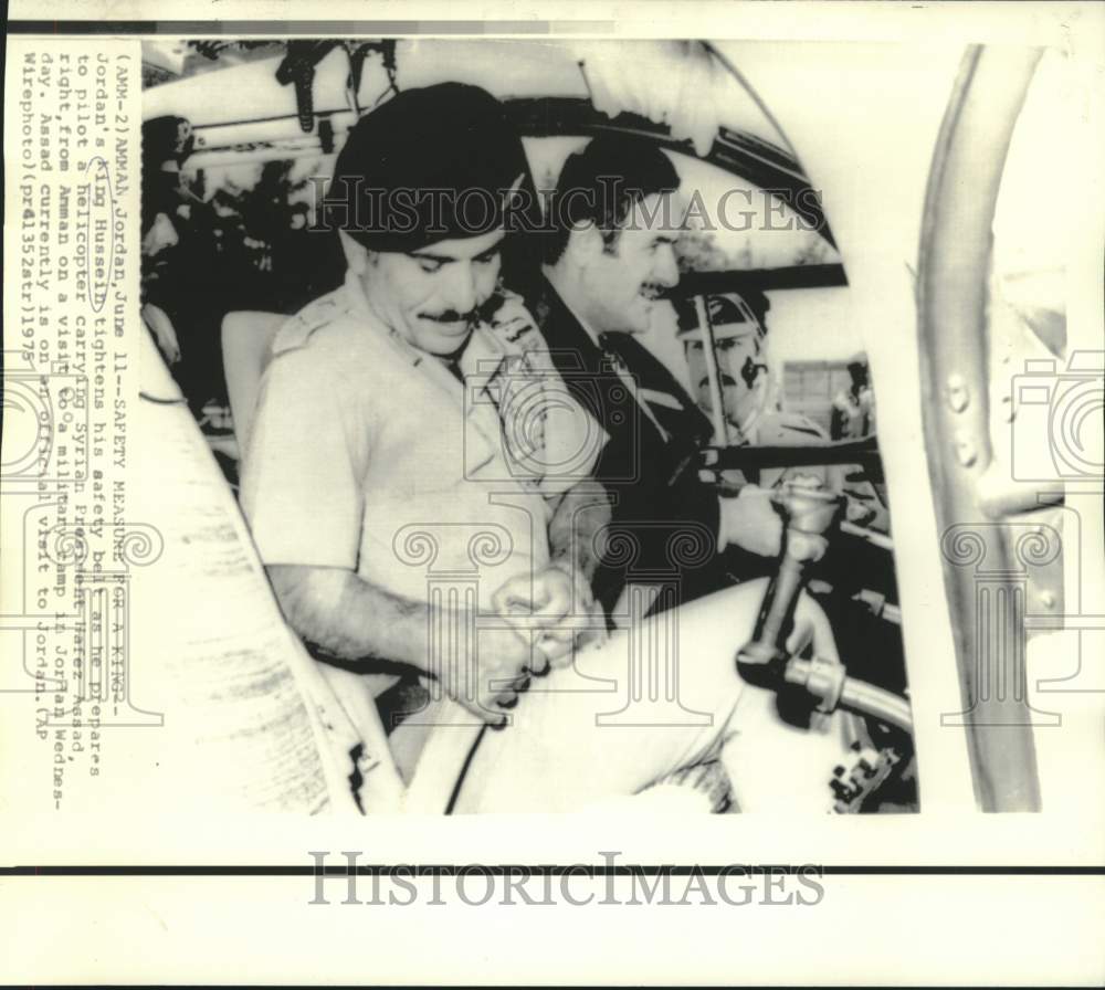 1975 Jordan&#39;s King Hussein prepares to pilot helicopter with Assad. - Historic Images