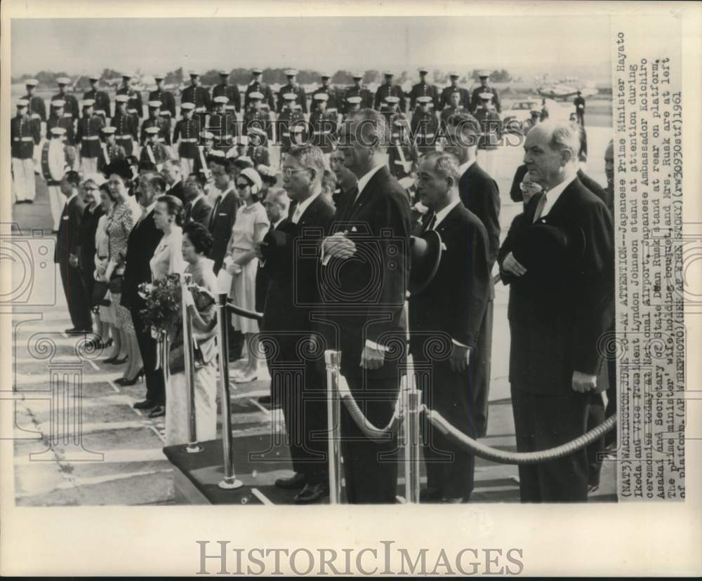 1961 Japan&#39;s Ikeda and Johnson with others stand at attention - Historic Images