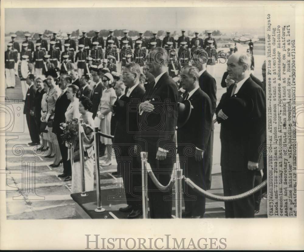 1961 Japan's Ikeda and Johnson with others stand at attention - Historic Images