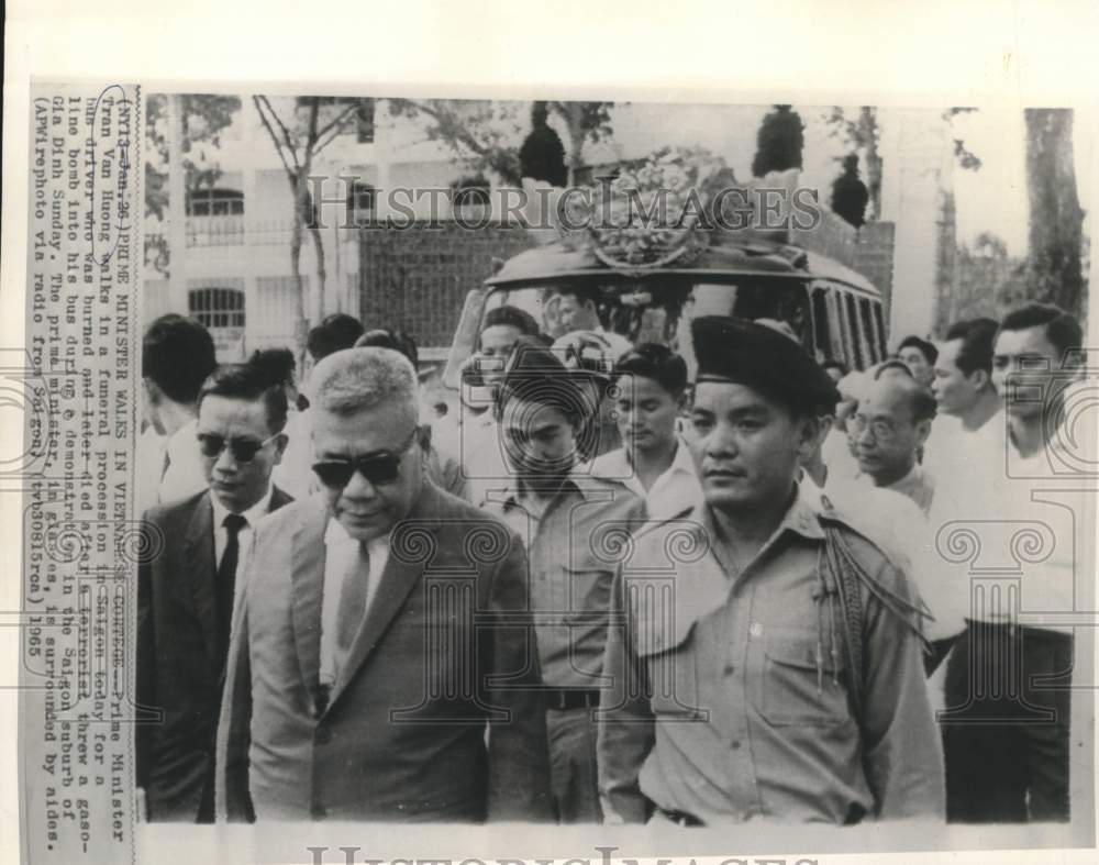 1965 Prime Minister Huong walks in funeral procession in Saigon - Historic Images