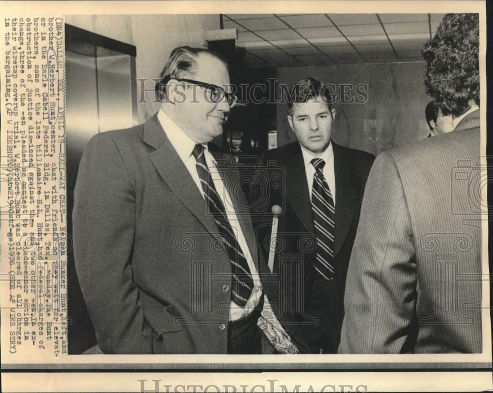 1976 Nelson and Herbert Hunt chat in Cabell Federal Building hall. - Historic Images