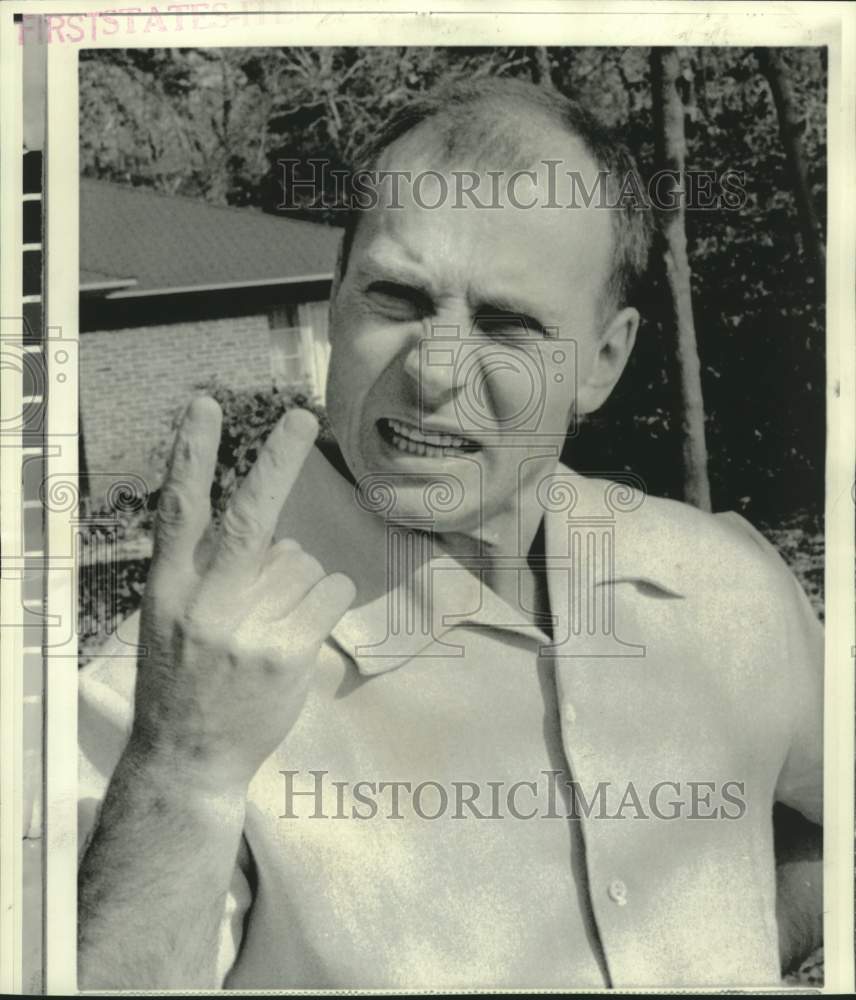 1974 Defecting Lithuanian seaman Simas Kudirka shows victory sign. - Historic Images