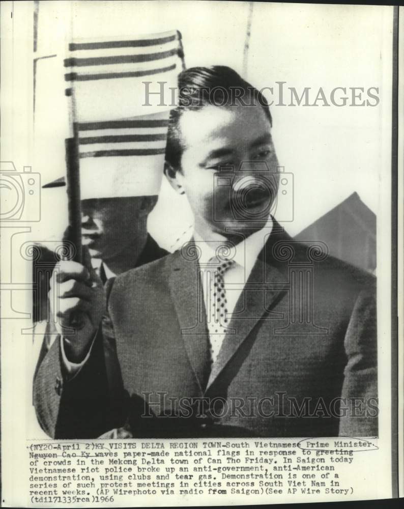 1966 Vietnamese Prime Minister Nguyen Cao Ky waves national flag - Historic Images