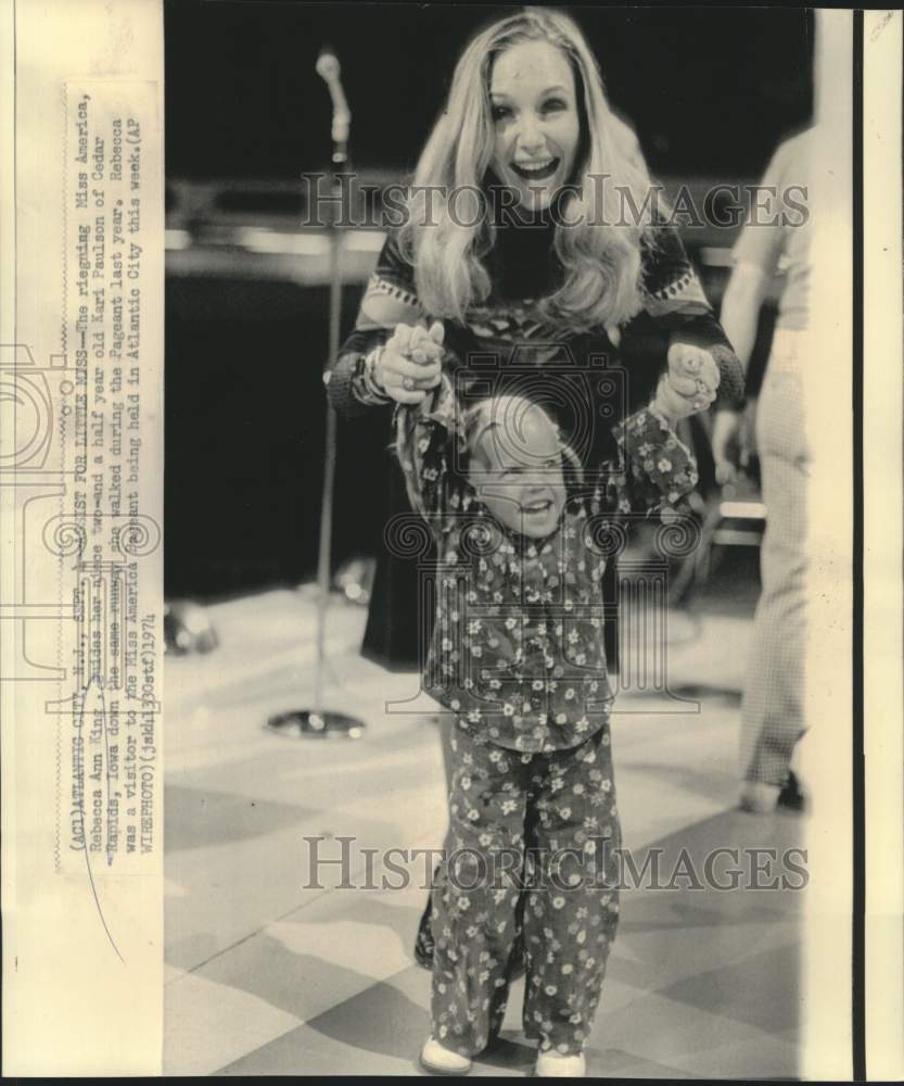 1974 Miss America 1974 with niece Kari Paulson walk the runway. - Historic Images