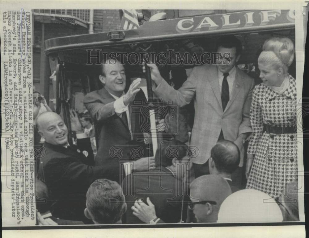 1968 Vice President Humphrey and others ride motorized cable car - Historic Images