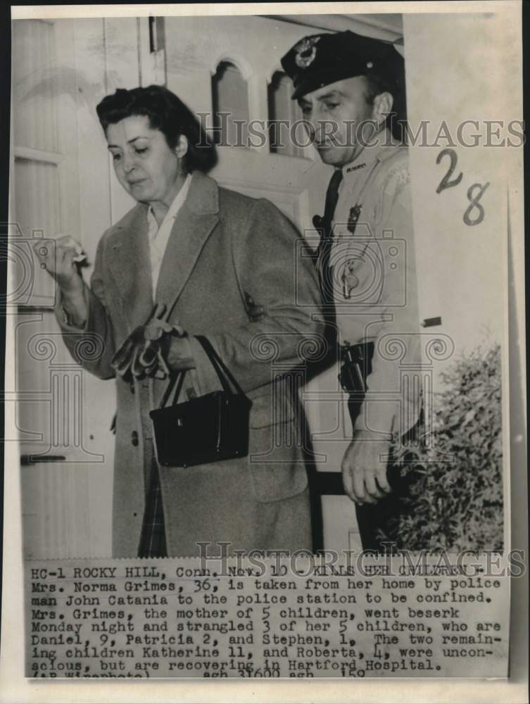 1959 Mrs. Norma Grimes escorted from home by policeman Catania. - Historic Images