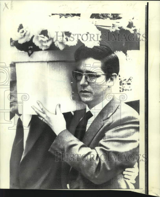 1973 John Crummey carries coffin of son Paul killed in Belfast - Historic Images
