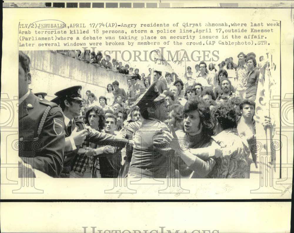 1974 Angry residents of Qiryat Shmonah storm police line - Historic Images