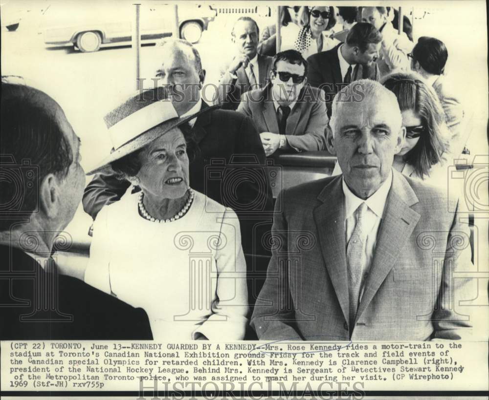 1969 Rose Kennedy with Clarence Campbell guarded by Det. Kennedy - Historic Images