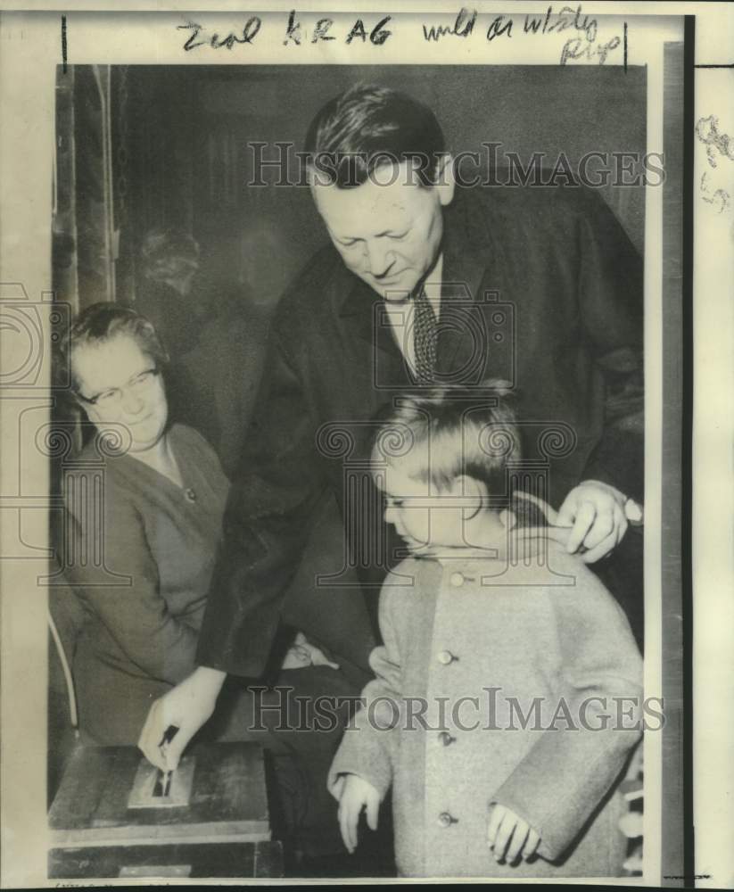 1966 Denmark&#39;s Prime Minister Jens Otto Krag with son casts ballot - Historic Images