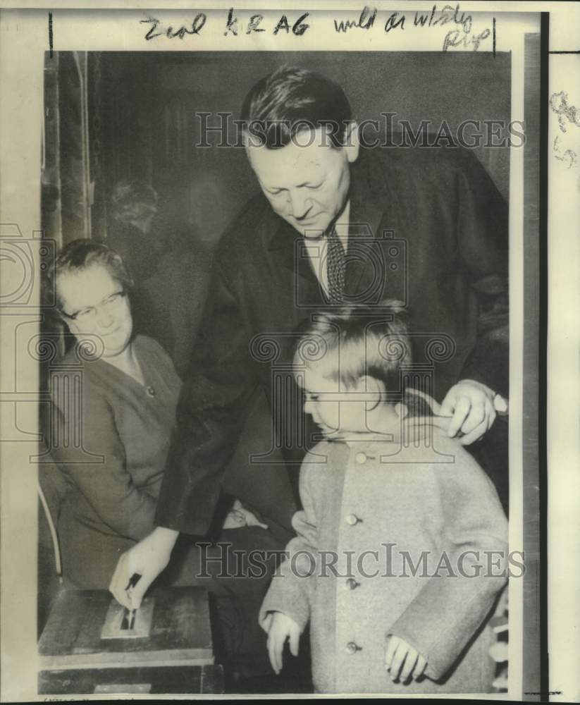 1966 Denmark's Prime Minister Jens Otto Krag with son casts ballot - Historic Images