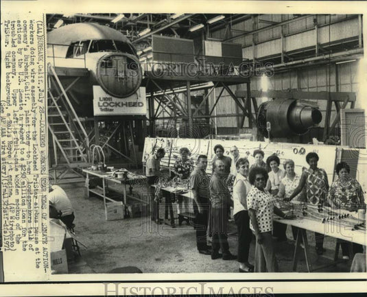 1971 Lockheed workers hear news of Senate action over loud speaker - Historic Images