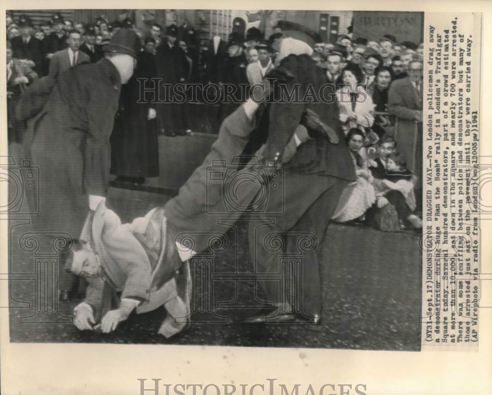 1961 London policemen drag away &quot;Ban the Bomb&quot; demonstrator - Historic Images