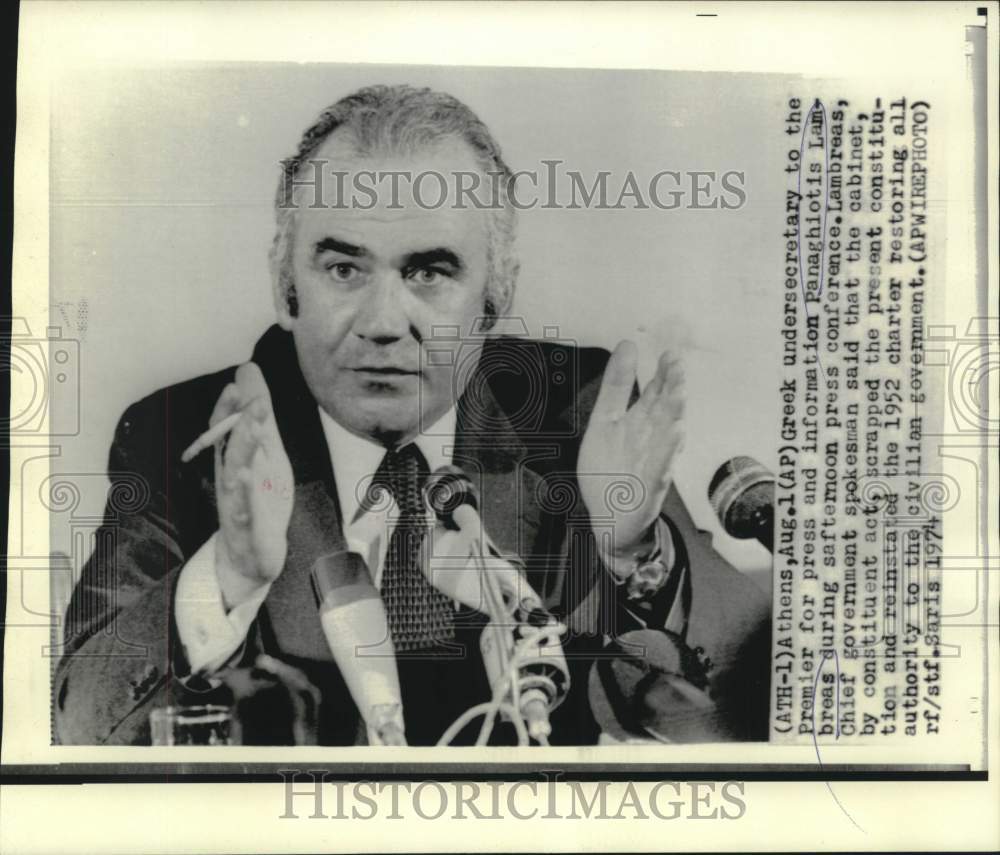 1974 Greek Undersecretary to Premier Panaghiotis Lambreas with press - Historic Images