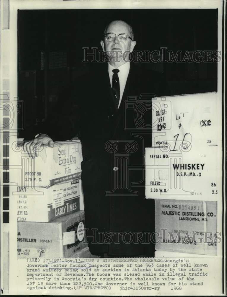 1968 Governor Lester Maddox with seized liquor up for sale at auctio - Historic Images