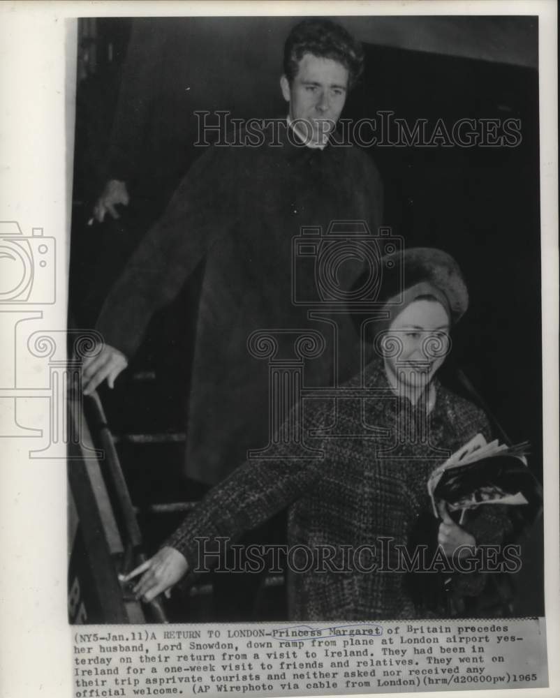 1965 Princess Margaret and Lord Snowdon deplane at London airport - Historic Images