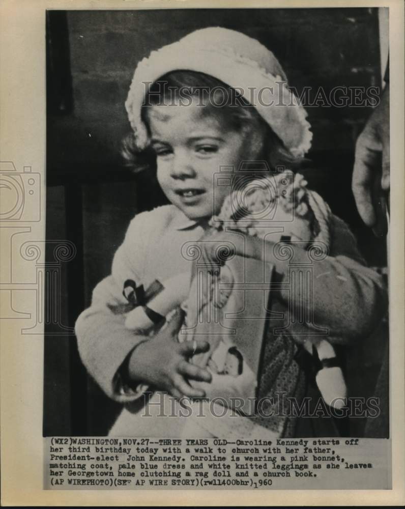 1960 Press Photo Caroline Kennedy walks to church with rag doll and church book-Historic Images