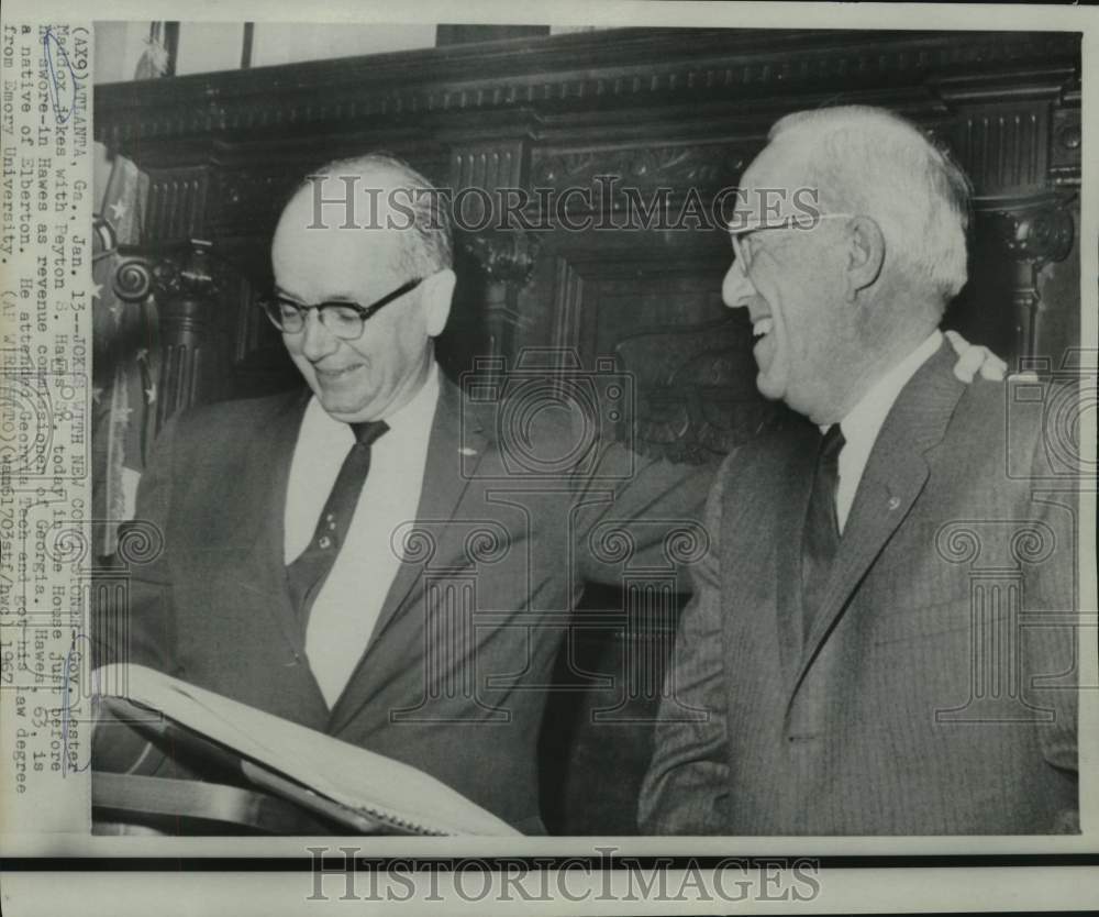 1967 Governor Lester Maddox jokes with Hawes in the House. - Historic Images