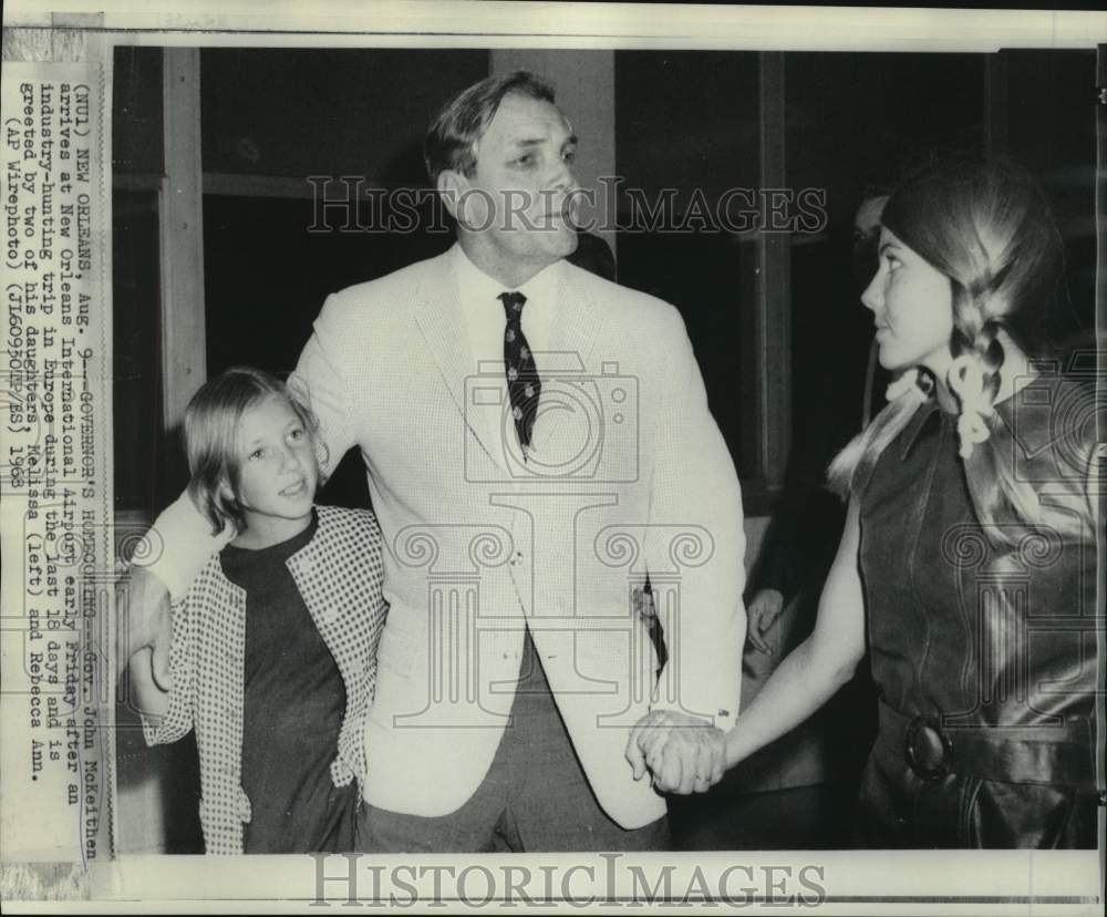 1968 Louisiana Governor McKeithen greeted at airport by family.-Historic Images