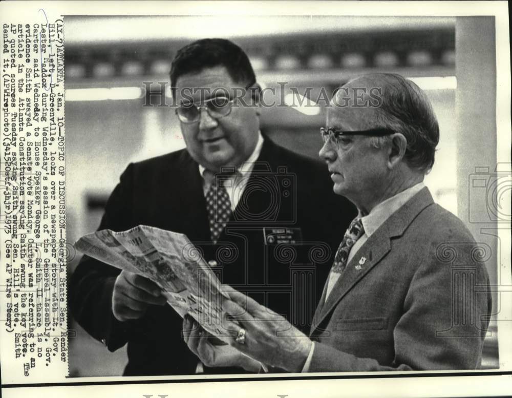 1973 Lt. Governor Maddox and state Senator Hill look over newspaper - Historic Images