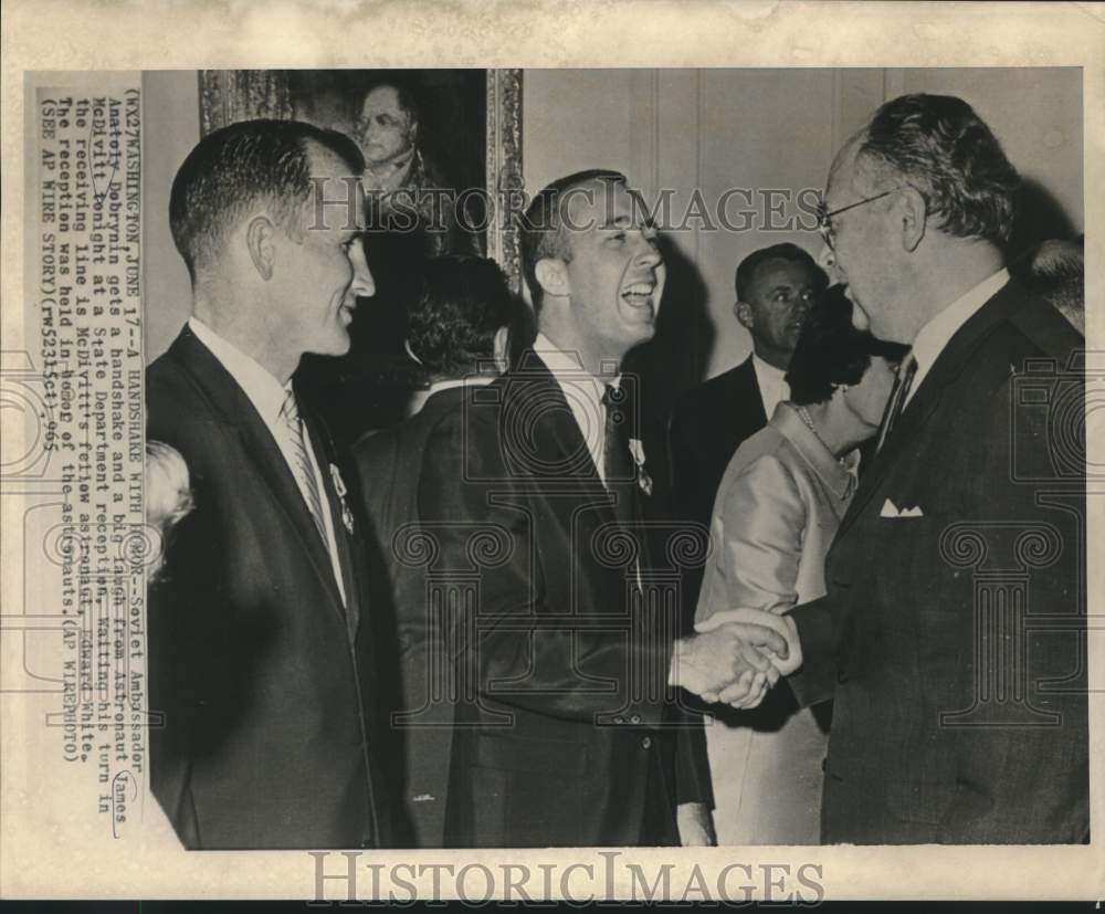 1965 Press Photo Anatoly Debrynin shakes hands with James McDivitt, Wash. DC-Historic Images