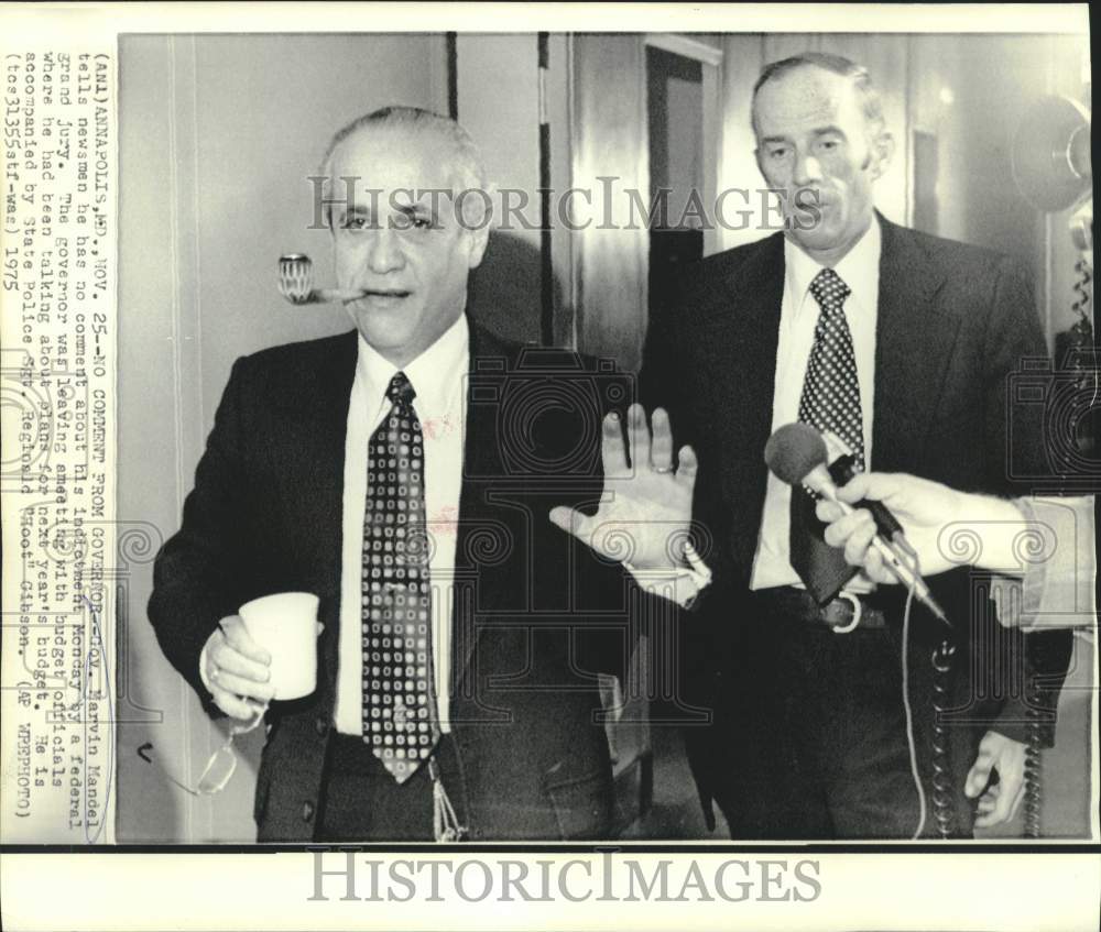 1975 Press Photo Maryland Governor Mandel with state policeman leaves meeting-Historic Images