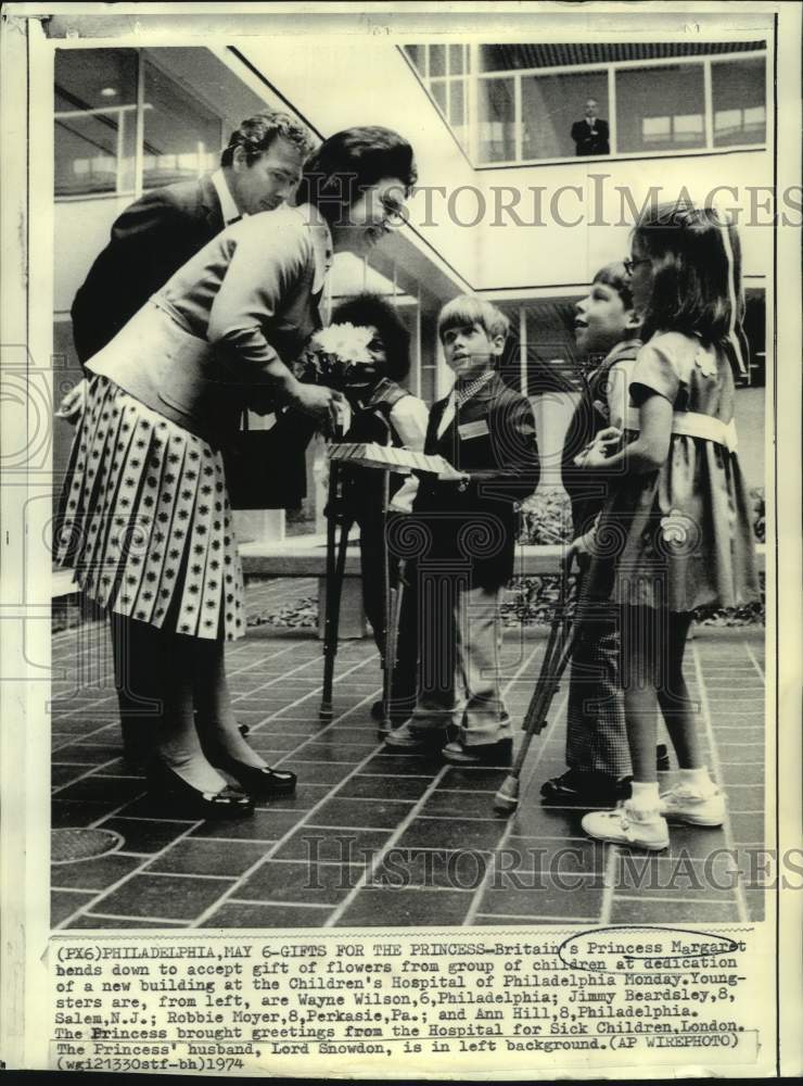 1974 Princess Margaret accepts gift of flowers from children - Historic Images