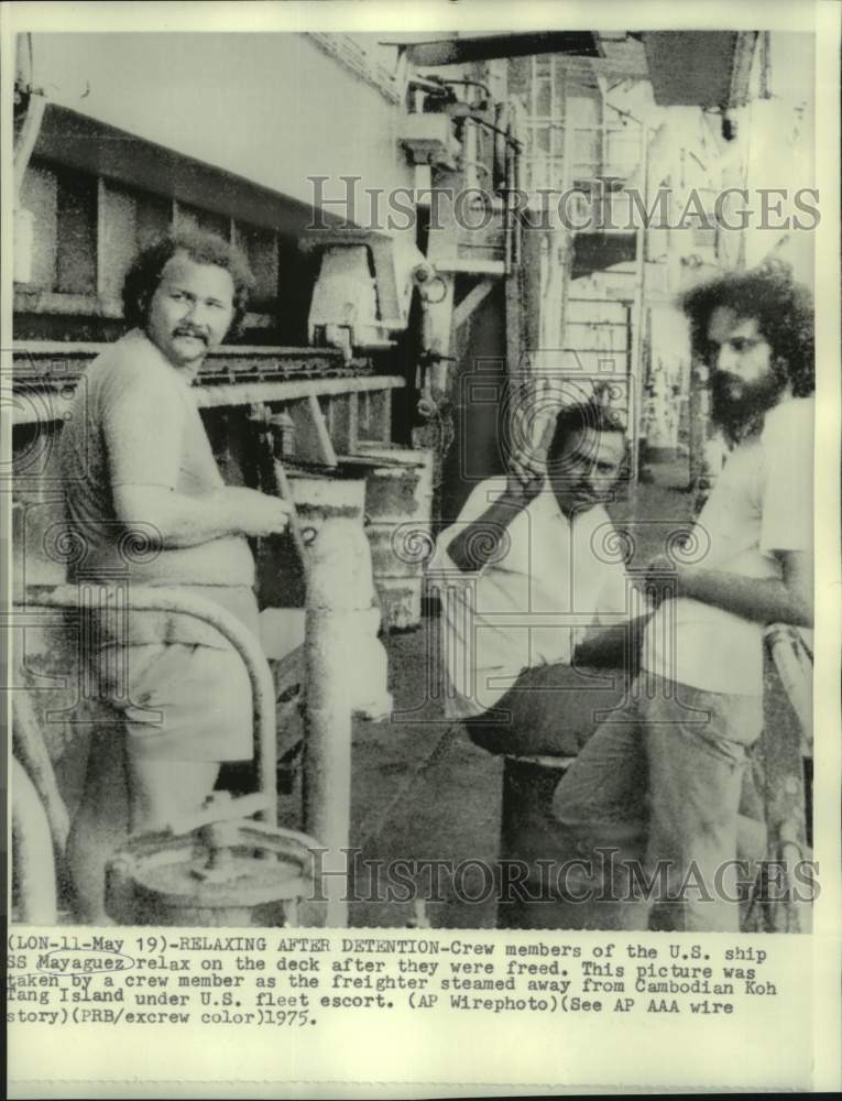 1975 USS Mayaguez crew members relax after freed by Cambodia - Historic Images