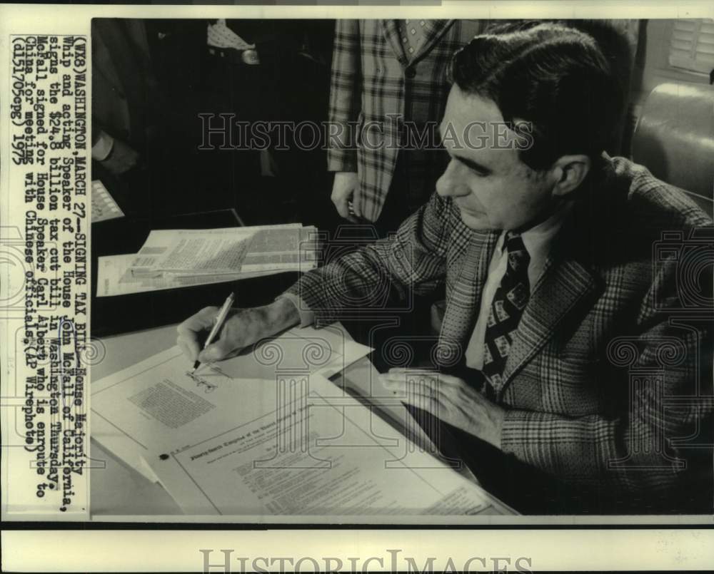 1975 House Majority Whip John McFall signs tax cut bill. - Historic Images