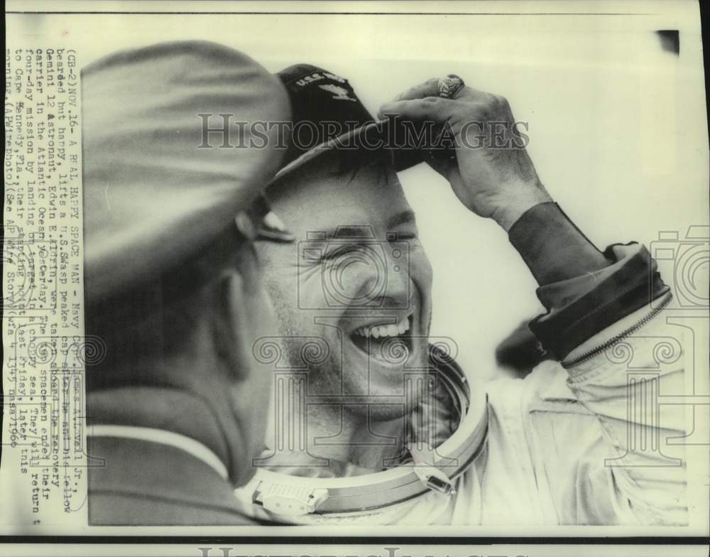 1966 Press Photo Astronaut James Lovell lifts U.S. Wasp cap on recovery carrier - Historic Images