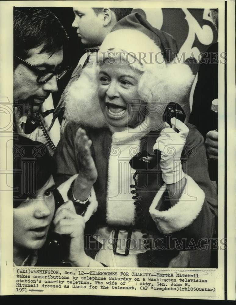 1971 Dressed as Santa Martha Mitchell takes telephone contributions - Historic Images