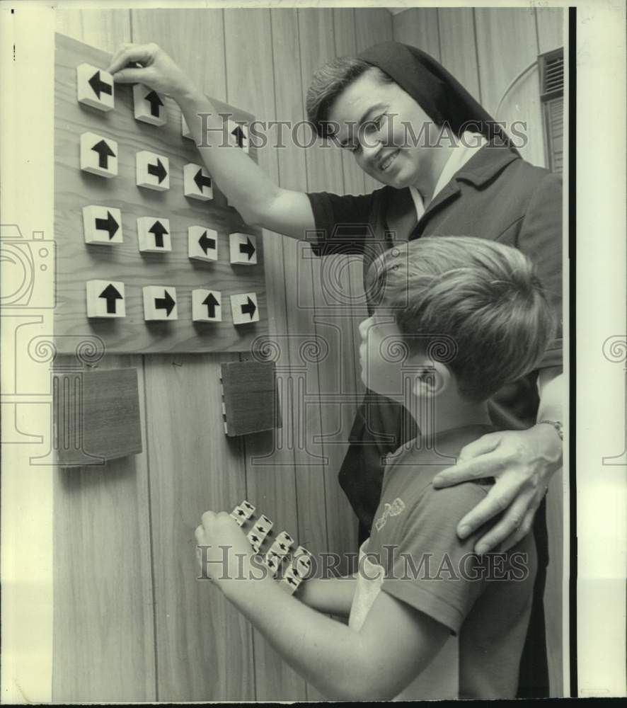 1973 Sister Mary Helen works with mentality retarded children - Historic Images