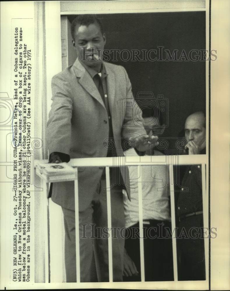 1971 Cuban delegation&#39;s Francia Metre hands cigars to newsmen - Historic Images