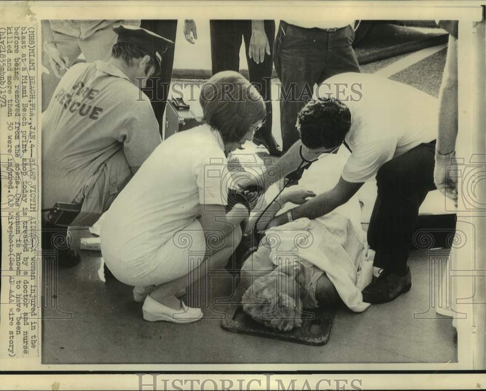 1971 Miami Beach Print shop blast, woman treated at blast scene - Historic Images