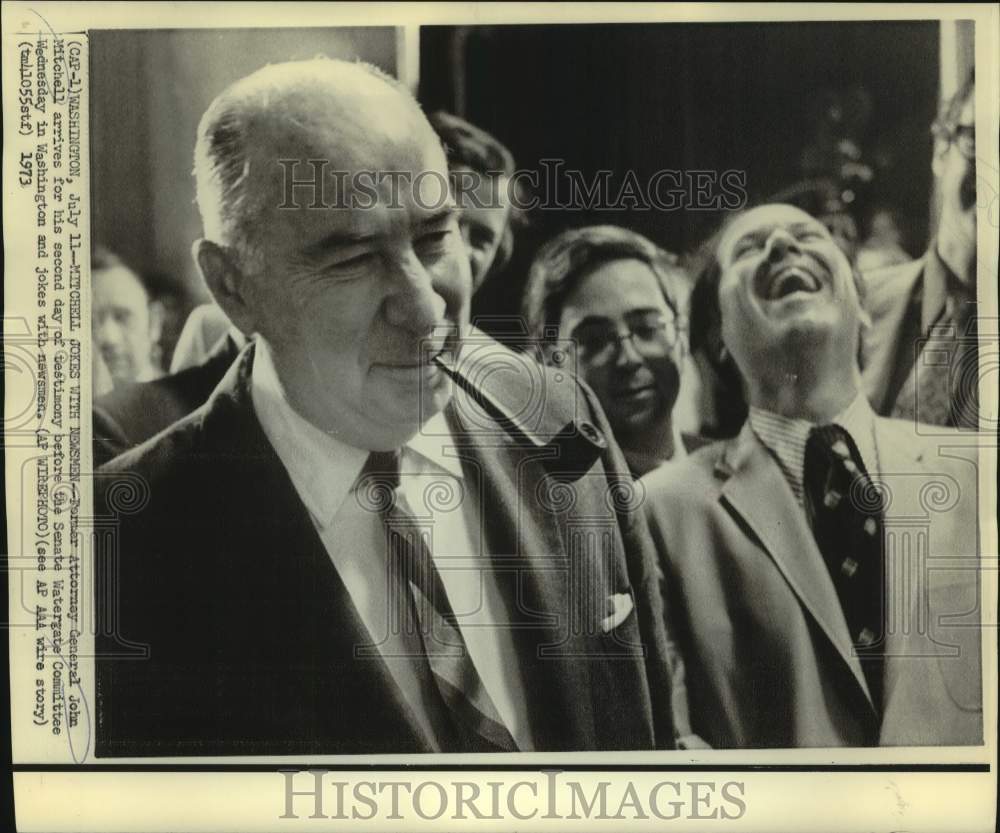 1973 John Mitchell arrives at Watergate hearing and jokes with press - Historic Images