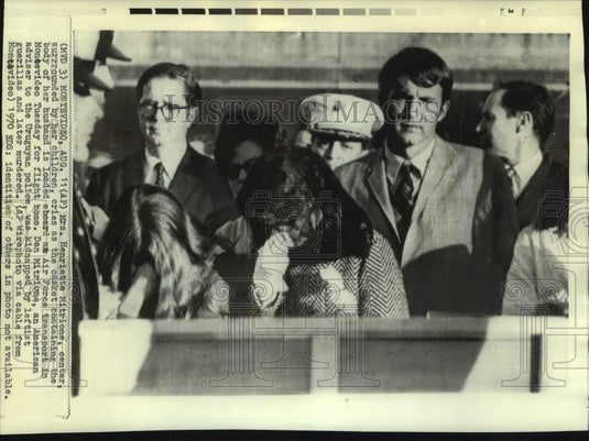 1970 Press Photo Henriette Mitrione cries as casket loaded in Air Force plane-Historic Images