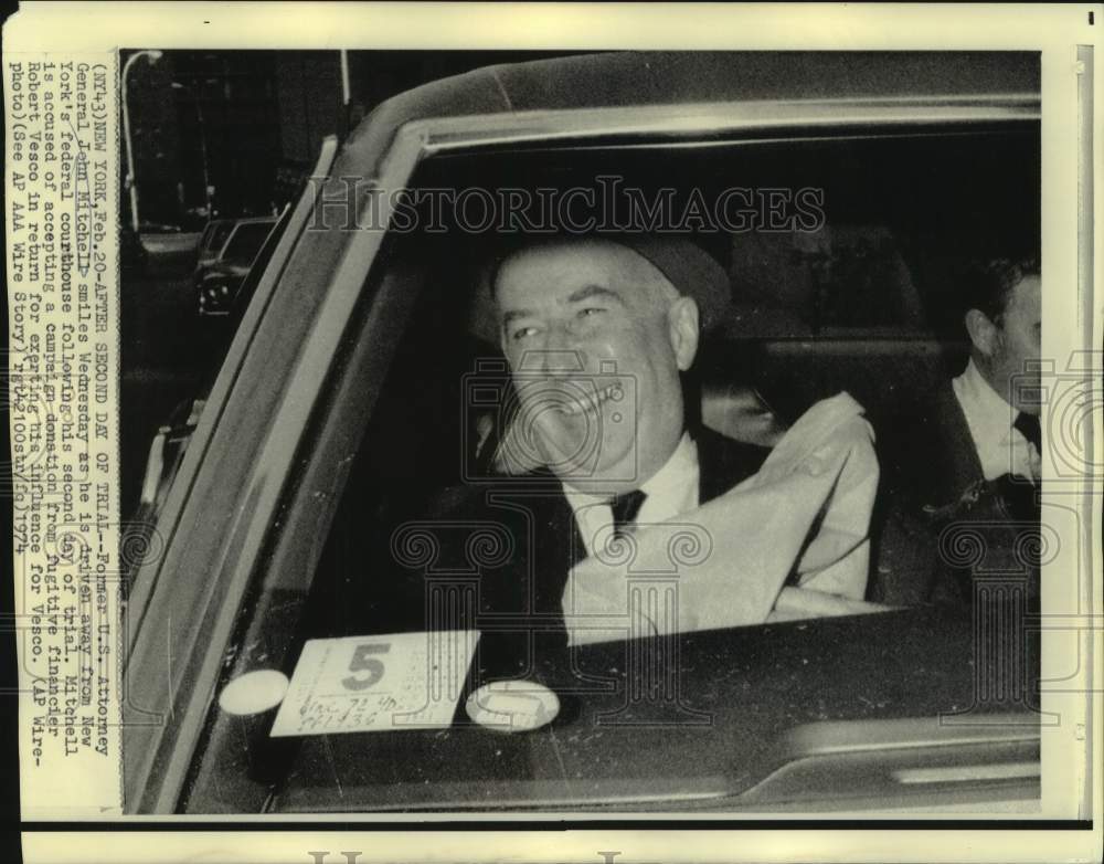 1974 Former Attorney General Mitchell smiles as driven from NY court - Historic Images