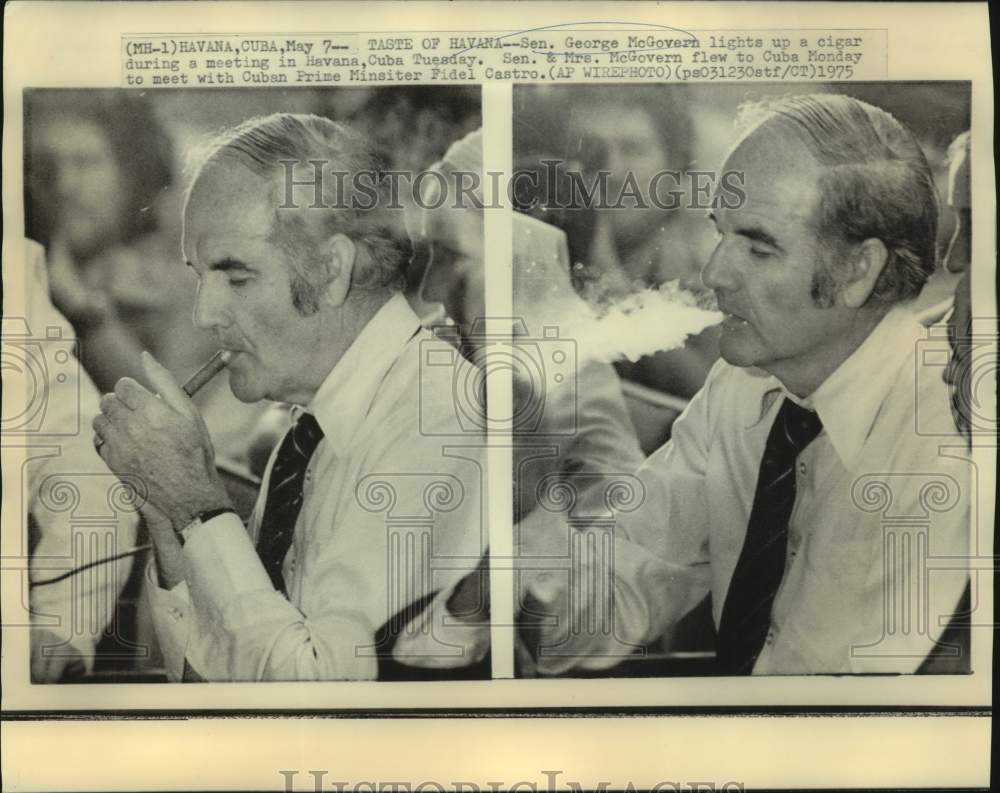 1975 Press Photo Senator McGovern lights up cigar at Havana, Cuba meeting. - Historic Images