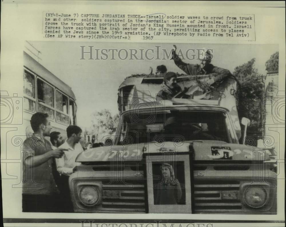 1967 Israeli soldier waves from captured Jordanian truck-Historic Images