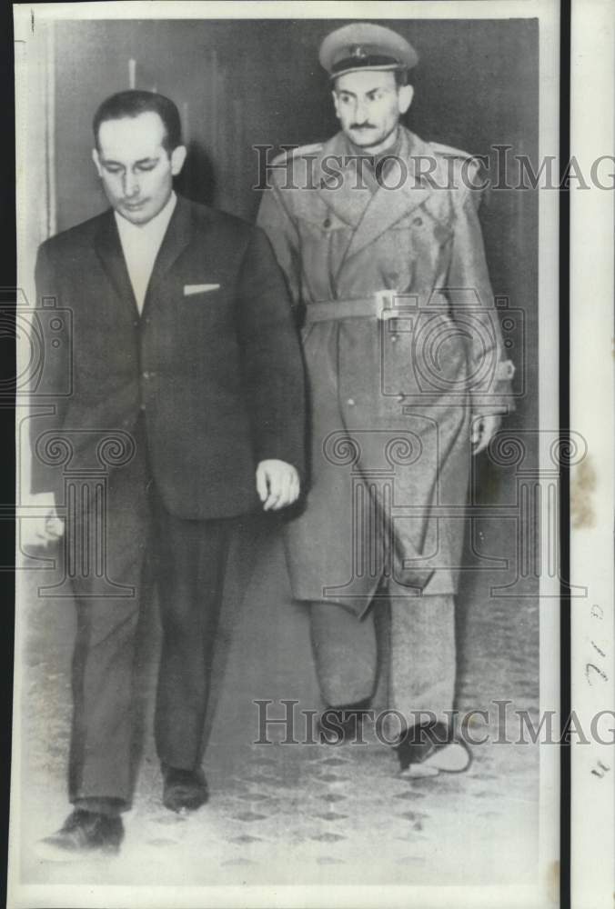 1967 Writer Mihajlo Mihajlov escorted in Belgrade court - Historic Images