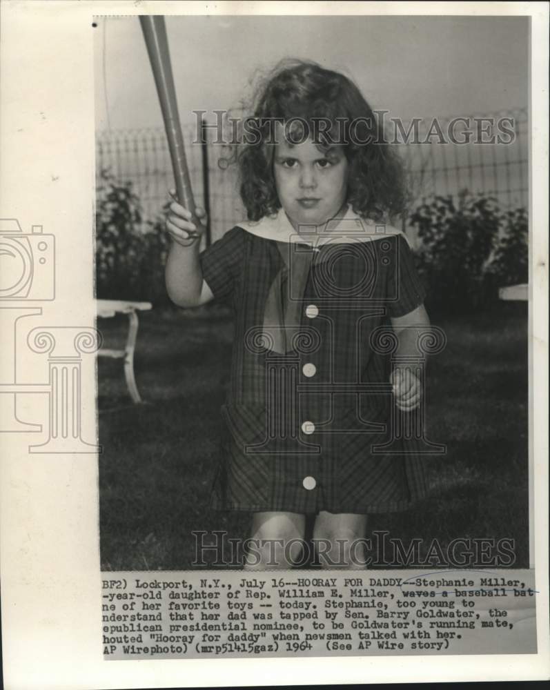 1964 Stephanie Miller waves baseball bat and shouts "Hooray" - Historic Images