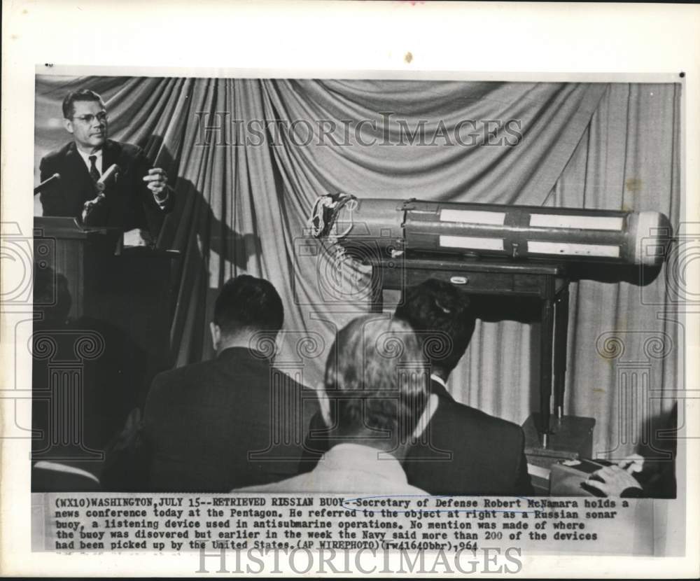 1964 Defense Secretary McNamara at Pentagon news conference. - Historic Images